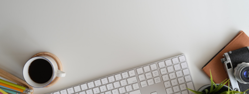Keyboard and coffee on desk