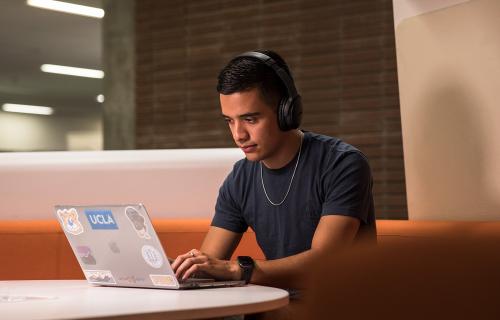 UCLA student studying with a laptop.