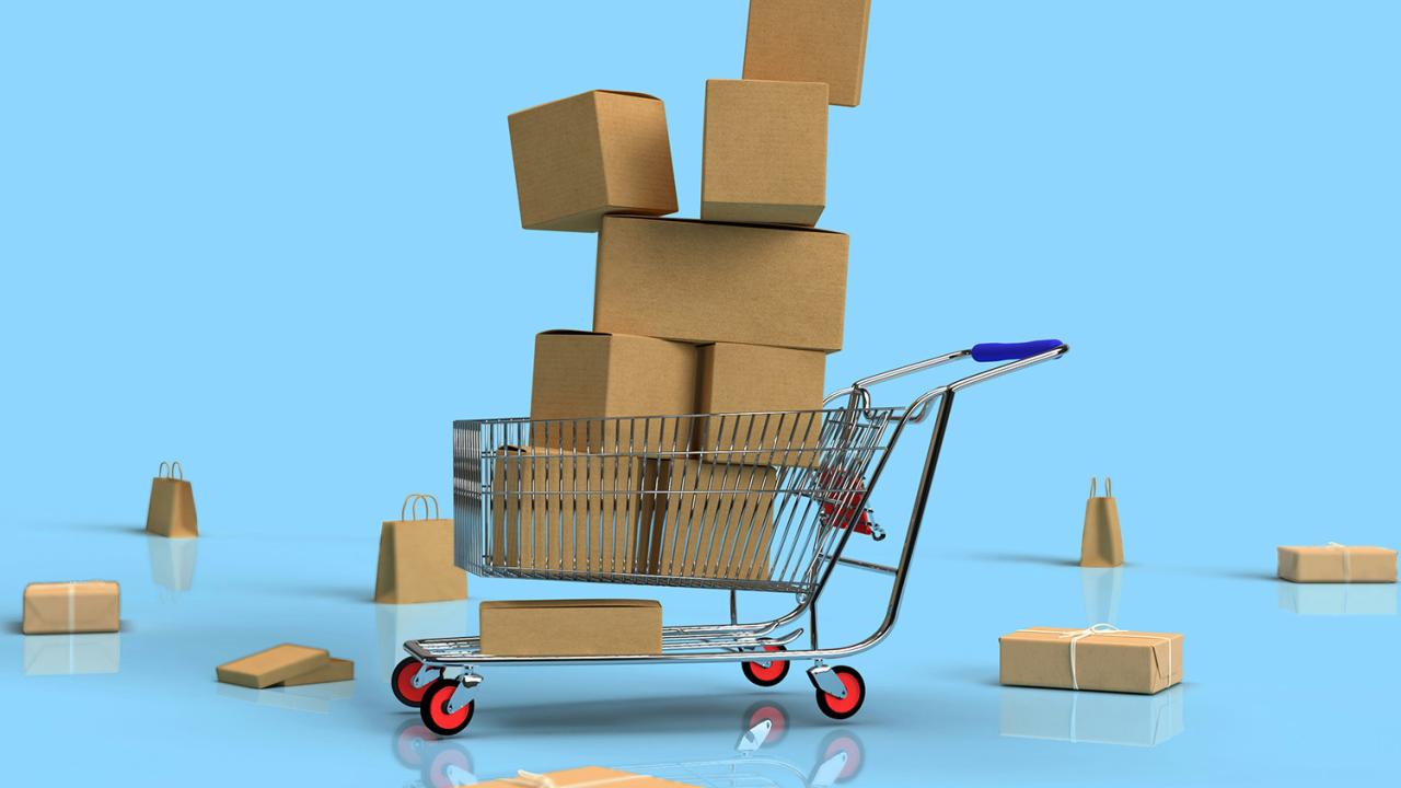 A shopping cart filled with boxes.