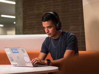 UCLA student studying with a laptop.